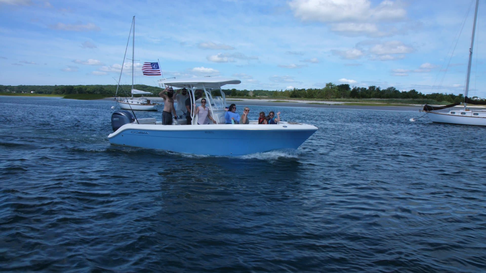 A family cruising aboard a Carefree Boat Club center console off the North Shore