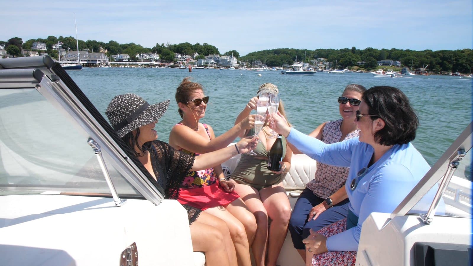 Members relaxing and socializing on deck with drinks